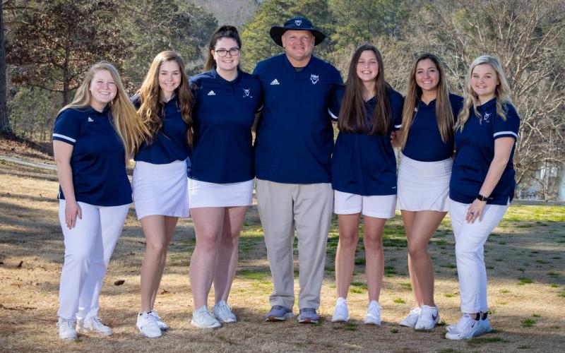 Lady Devil golfers include (L-R) Emma Grace Jarvis, Elizabeth Brady, Ava Dye, Coach Bruce Brown, Abby Bryant, Madison Webb and Emaleigh Oglesby.