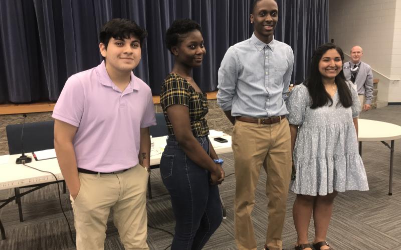 REACH award winners at Monday’s BOE meeting are (L-R): Angel Castillo, Myiah Davis, Korbin Eberhardt and Melanie Guerreo Blanco. Kimberly Segura, another award winner, is not pictured. (Photo by Jones)