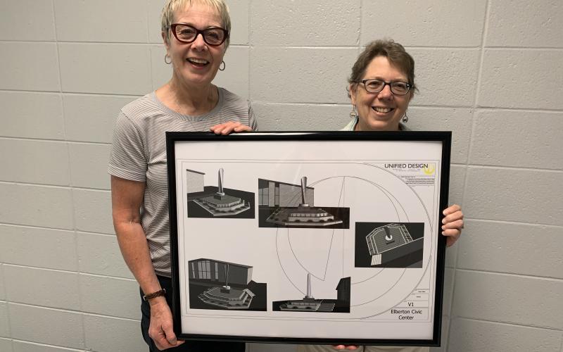 Gerry Besharat (left) and Pam Allgood display plans for the “Granite Feather,” which will displayed at the Elbert County Chamber of Commerce entrance. (Photo by Scoggins)