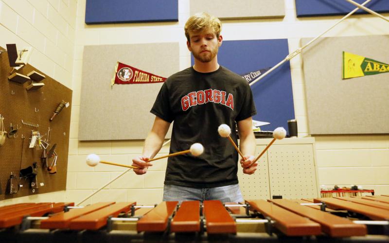 Salutatorian Ethan Cone plays the marimba in the band room at Elbert County Comprehensive High School. Cone said music and band have been his favorite part of high school. (Photo by Scoggins)