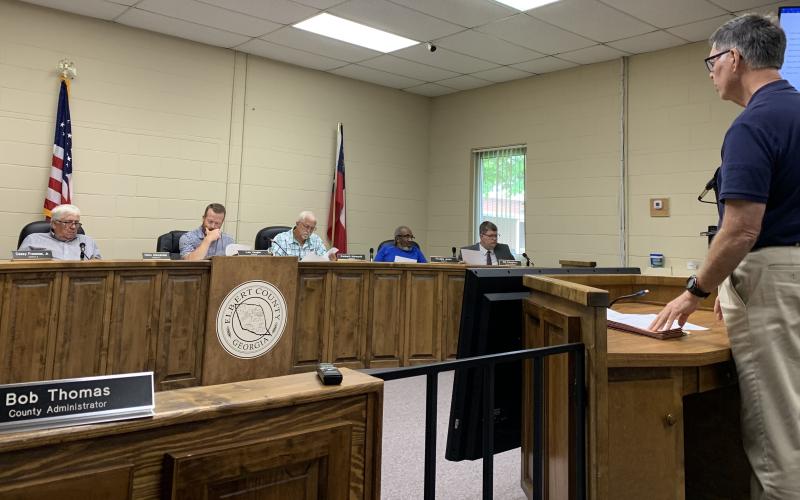 Elbert County Chief Financial Officer Phil Pitts (right) talks about the 2021-2022 budget in front of the Elbert County Board of Commissioners Monday afternoon. The commission approved the budget, which includes a $1.2 million increase, with over half for raises within the county government. (Photo by Scoggins)