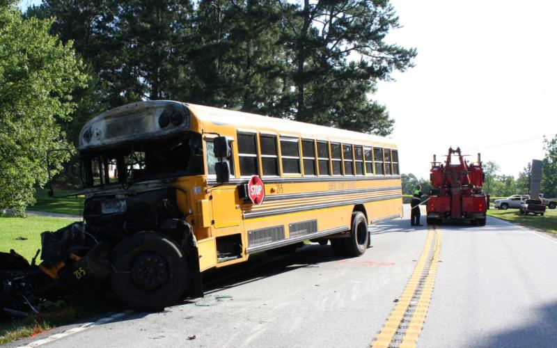 Charred remains of an Elbert County school bus were towed away after last Wednesday’s traffic fatality on Georgia Highway 368 (Anderson Highway).