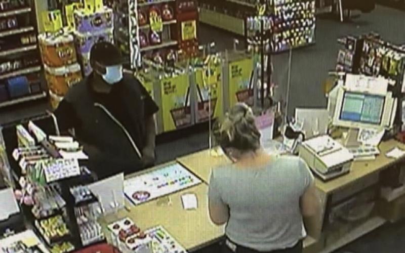A man walked into this CVS on Elbert Street Saturday just before noon and slipped a clerk a note with a list of demands, according to an Elberton Police Department spokesman. The man left with an undetermined amount of money, said the spokesman. (Photo released by Elberton Police Department).