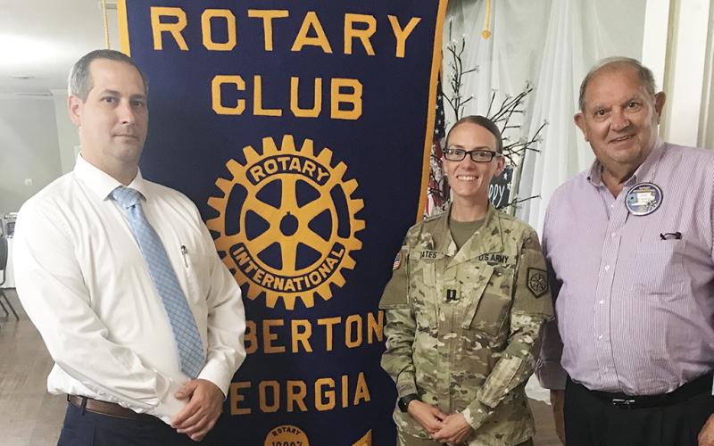 Capt. Bates (center) recently spoke at the Rotary Club of Elberton. Rotary President Chris Dyal is on the left and Rotarian and former National Guard General Joel Seymour is on the right (Photo by Jones)