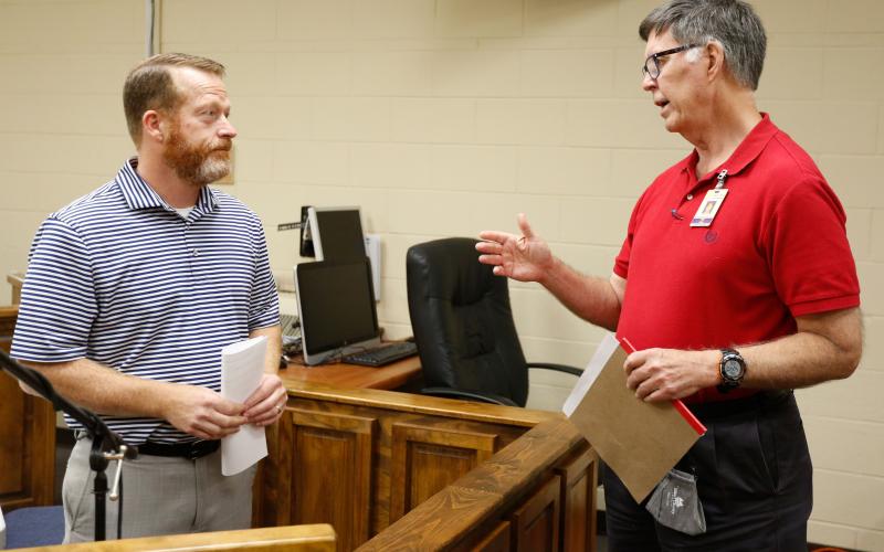County Commission Chairman Lee Vaughn (left) and recently selected County Administrator Phil Pitts talk after a recent meeting of the Elbert County Board of Commissioners. Pitts says he wants to work closely with the City of Elberton and the City of Bowman and make sure the Elbert County Senior Center continues to operate smoothly. Pitts will take over with the coming retirement of Bob Thomas, who has served as county administrator for 15 years. (Photo by Scoggins)