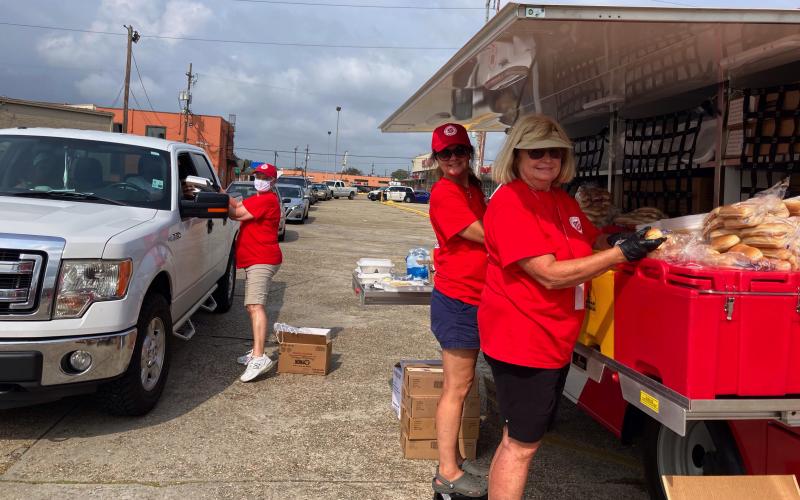 Local Salvation Army volunteers (L-R) Ann Hendrix, Pam Brown and PJo Phelps serve meals in New Orleans.