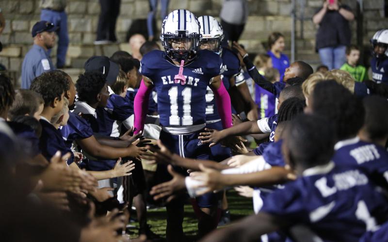 Blue Devil Christian Harris walks through a tunnel of future Blue Devils and current football players from Elbert County Parks and Recreation before the Oct. 15 game against Union County in the Granite Bowl. (Photo by Scoggins)