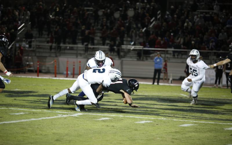 Senior Trez White sacks Wildcat quarterback and University of Georgia football commit Gunnar Stockton for a four-yard loss during the Blue Devils’ 45-7 region loss against Rabun County Friday, Oct. 22 in Tiger. (Photo by Scoggins)