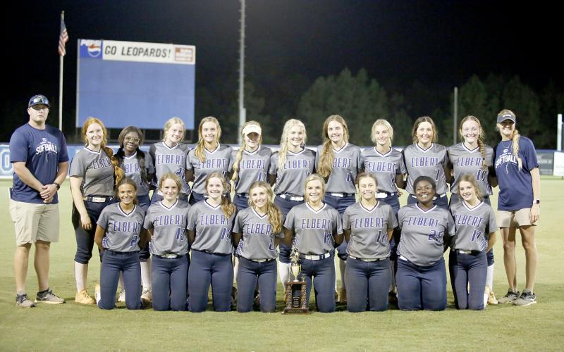 The 2021 Lady Devils softball team poses with the second-place trophy Saturday, Oct. 9 after falling 1-0 to Banks County in the region championship game.