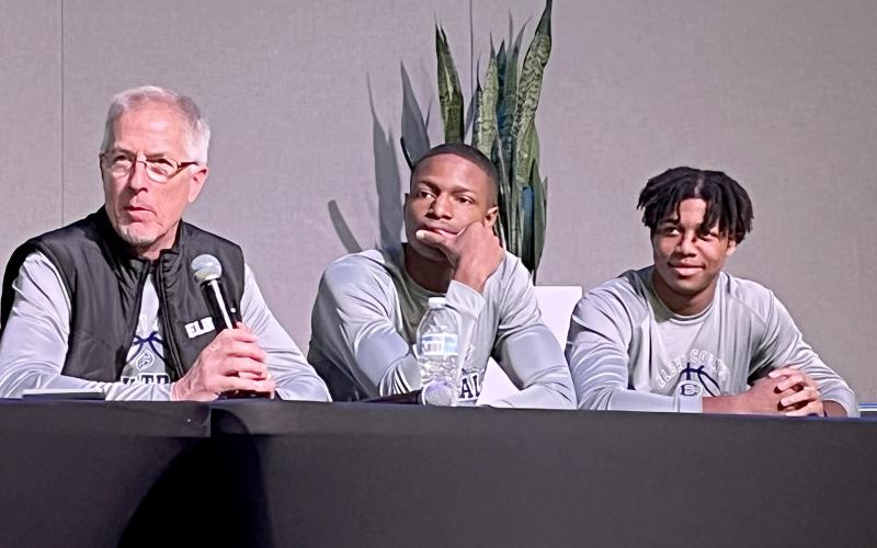 Elbert County boys basketball coach Don Hurlburt listens to a question along with players (from left) Jamil Burton and Trustin Allen. (Photo by Matthew Osborne, CNI News Service)
