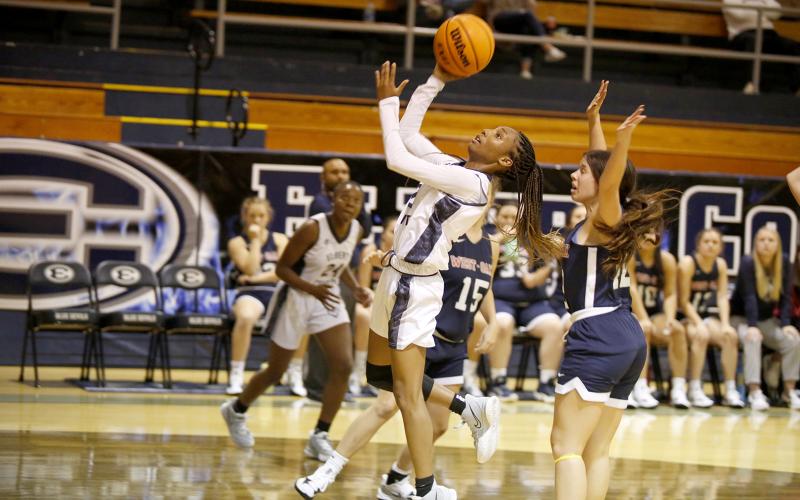 Junior Niya Moon goes for a layup during Thursday’s scrimmage against West Oak in the Inferno. The Lady Devils, along with head coach Josh Jones, are looking to bring home a state championship this season. (Photo by Scoggins)