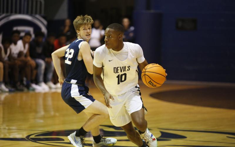 Senior Jamil Burton, pictured above during Thursday’s scrimmage against West Oak, will lead the Blue Devils this year. The Devils, along with Coach Don Hurlburt, are looking to defend the region championship title the team took home last season. (Photo by Scoggins)
