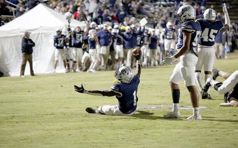 Quan Moss reacts to scoring a touchdown for the Blue Devils during the team's 26-14 loss in the first round of the GHSA state playoffs in the Granite Bowl Friday, Nov. 12.. (Photo by Scoggins)