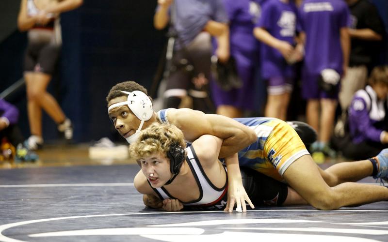 Zion Cullars works to pin his Harlem opponent Nov. 30. The Mat Devils are scheduled to host 12 teams during the Inferno Invitational Saturday, Dec. 11 at 9 a.m. (Photo by Scoggins)