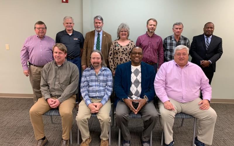 The full Elbert Memorial Hospital Authority Board met for the first time Tuesday, Nov. 30 at Athens Tech after the newest board member, Darin Rucker, was sworn in as a member. The authority board includes (front row, L-R) Chairman Leon Jourolmon, Vice Chairman Max Black, treasurer Kam McClary and secretary Scott Wilson; (back row, L-R) Dan McAvoy, Tom Steele, Steve Jenkins, Tammy Dalton, Matthew Jenkins, Mike Webb and Rucker. (Photo by Scoggins)