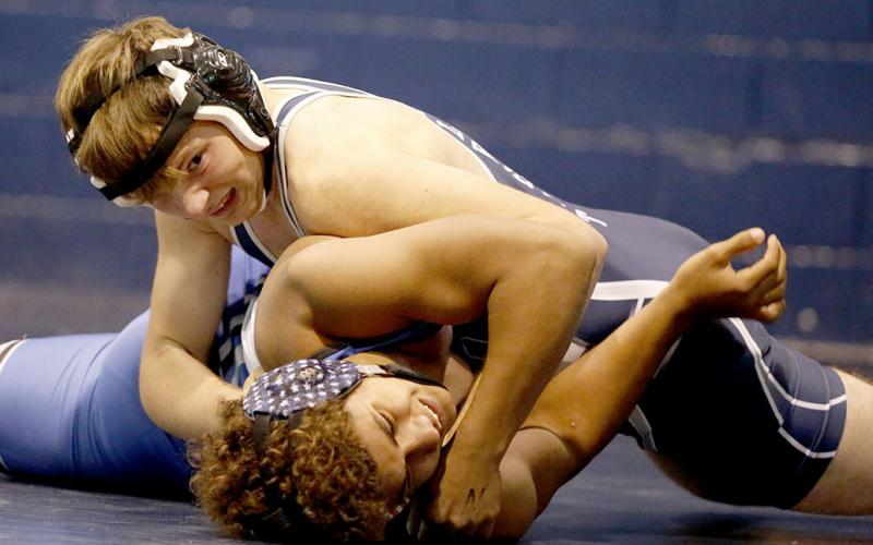 Josiah Harkins makes a half nelson pin during the JV Inferno at the Inferno Tuesday, Nov. 23. Harkins finished in second place for the day at 152 pounds. (Photo by Scoggins)