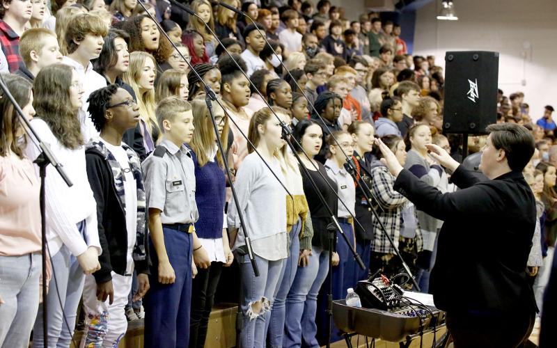 The Elbert County Chorus program, led by Director Allyson Dye and pictured above during the annual Veterans Day program at ECCHS, is raising funds to perform at the Pearl Harbor commemoration in Hawaii next year. (Photo by Scoggins)