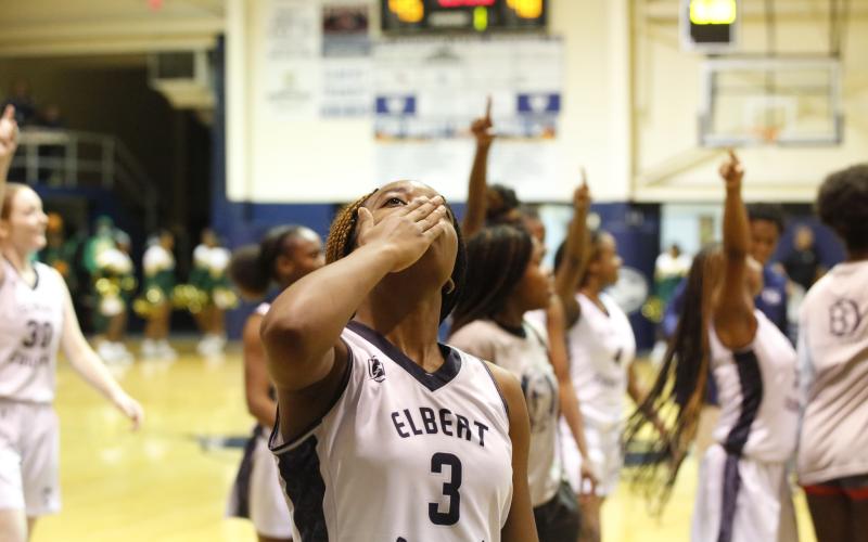 Junior Lady Devil Aaniyah Allen blows a kiss to the scoreboard while the rest of the Lady Devils show off the score to the crowd of Josey Eagle fans after the Lady Devil’s 48-45 win over Josey High School Saturday, Dec. 4 in the Inferno. The match up between the two teams was a big rematch for the Lady Devils, who fell to the reigning state champion Lady Eagles 46-45 in last season’s Elite Eight game in the Inferno. (Photo by Scoggins)