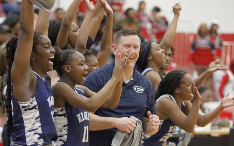Head Coach Josh Jones and the Lady Devils' bench celebrate after defeating Callaway High School Tuesday, March 1 to advance the team to the Final Four round for the first time since 1966. (Photo by Scoggins)