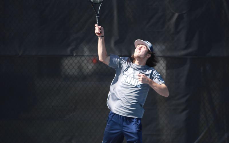 The Devils tennis team, including Alex Bennett (right) finished fourth in the region. Both teams were scheduled to advance to the first round of the GHSA state playoffs Tuesday. (File photos by Scoggins)