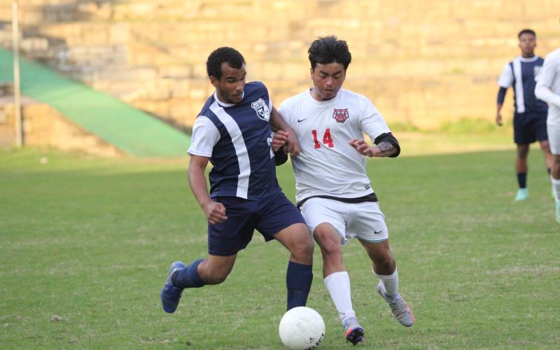 Jamaze Hall attempts to work the ball away from a Rabun County defender during the Devils’ 10-0 loss against Rabun County Friday, April 8. (Photo by Wells)