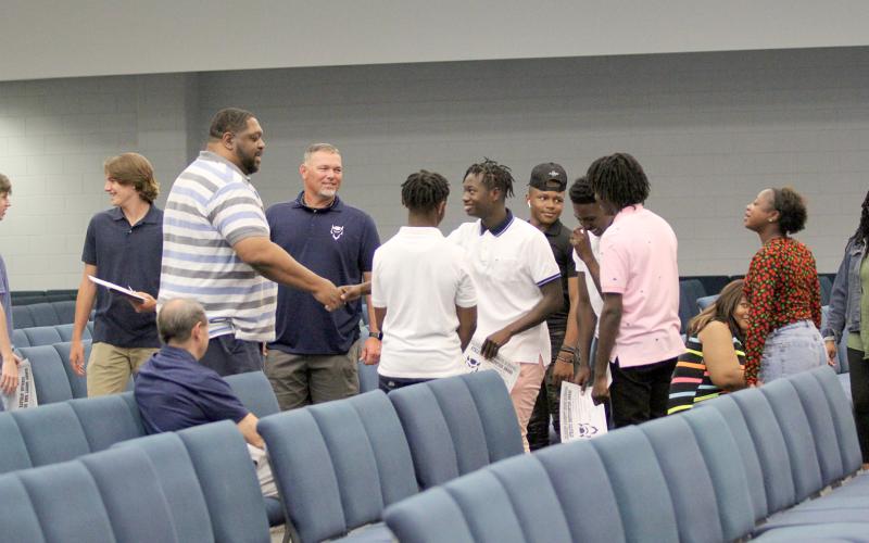 Coach Ed Geth (left) was introduced to members of the Devils basketball team Monday, April 25 during the team’s end-of-the-year banquet. Although not officially hired, the committee to hire a new Devils head basketball coach will recommend the BOE hire Geth at the May 9 work session. (Photo by Wells)