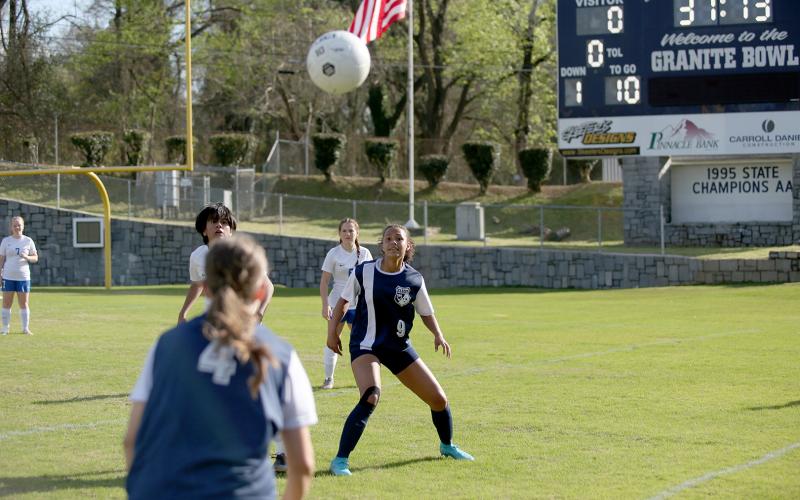 Jade Partain (No. 4) makes a throw in towards Hannah Halavin during the Lady Devils win over Banks County. (Photo by Wells)