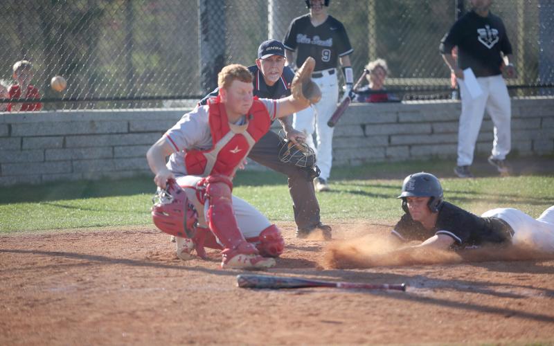 Landon Heaton slides into home during the Diamond Devils’ doubleheader against Rabun County Friday, April 1. The Diamond Devils will host Oglethorpe County Thursday. (Photo by Wells)