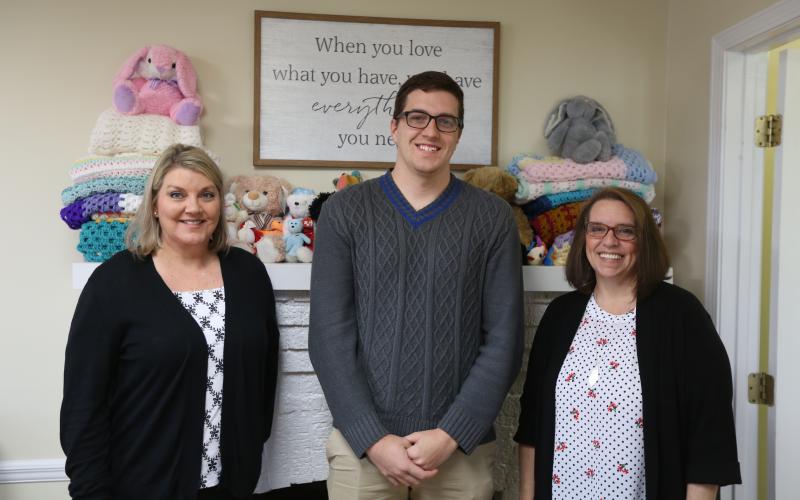 Harmony House’s (L-R) Client Services Advocate Jennifer Rainer, Mental Health Counselor Darrin Haley and Outreach/Volunteer Coordinator Wendy Risner are working to bring community awareness to what Harmony House does during National Child Abuse and Sexual Assault Awareness Month. (Photo by Scoggins)