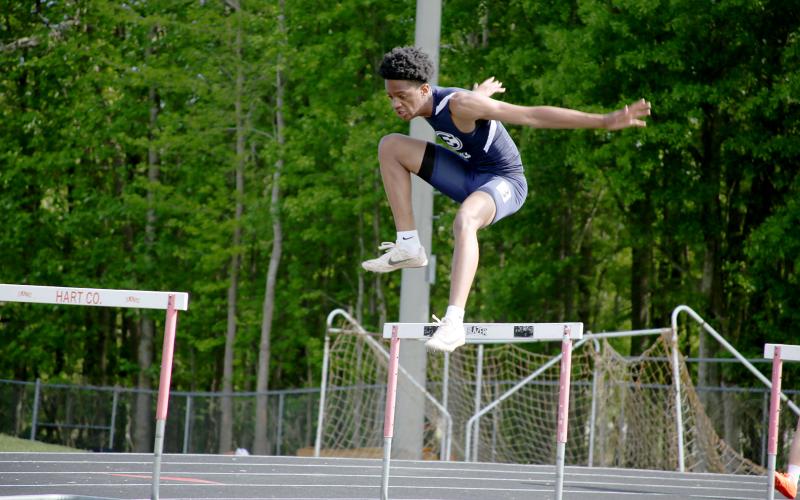 Track Devil Chastain Williams finished with a season best in the 300 meter hurdles during the Hart County meet Thursday. (Photo by Scoggins)