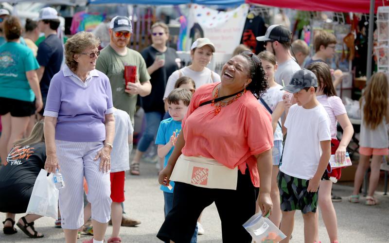 After several attempts to pull a winning number, Linda Allen laughs as a cakewalker pulls his own number to take the cake during the City of Bowman’s annual spring festival and Big Iron Crank Up Saturday, April 23. For more photos, see page 8. (Photo by Scoggins)