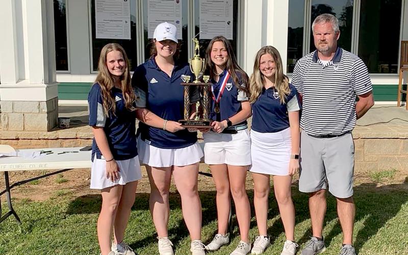 Elbert County’s Lady Devils took home the Area 4AA championship trophy Wednesday, April 27 at Arrowhead Pointe Golf Course after defeating defending state champion Lovett.