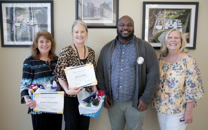 Pictured during a surprise presentation honoring them as the Emmanuel College Cooperating Teachers of the Month for May were (L-R) teachers Kerri Wiliams, Kelly Gary, nominating student teacher Isaiah Garnett and Director of Field Experience at Emmanuel Debbie Maxwell. (Photo by Scoggins)