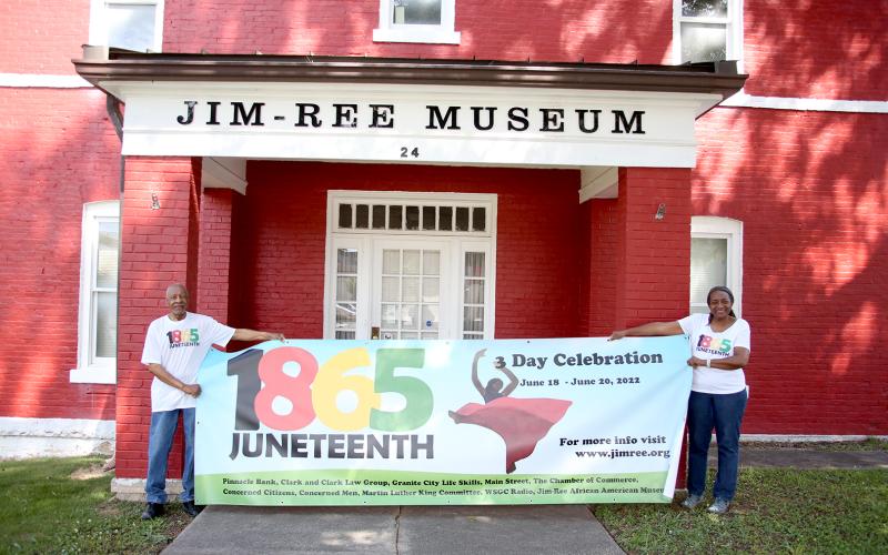Jimmy White (left) and Aurolyn Hamm White (left) showcase the banner that will be hung from the entrance of the Jim-Ree Museum showcasing the three day Juneteenth Celebration planned for Saturday, June 18 through Monday, June 20. (Photo by Scoggins)