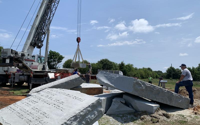 Emergency Management Agency Director Chuck Almond surveys the scene as the demolished Georgia Guidestones were removed from the site Thursday. (Photo by Scoggins)