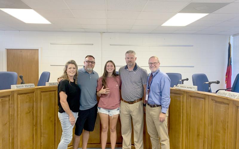 Pictured during the meeting are (L-R) parents Jessica and Travis Bryant, Bryant, Coach Larry Kesler and Superintendent Jon Jarvis. (Photo by Wells)