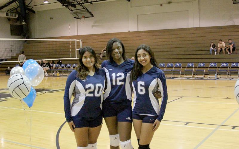 Senior Lady Volley Devils (L-R) Lizzy Landaverde, Brenasia Faust and Lizett Nava were honored during senior night Monday, Sept. 26. (Photo by Wells)