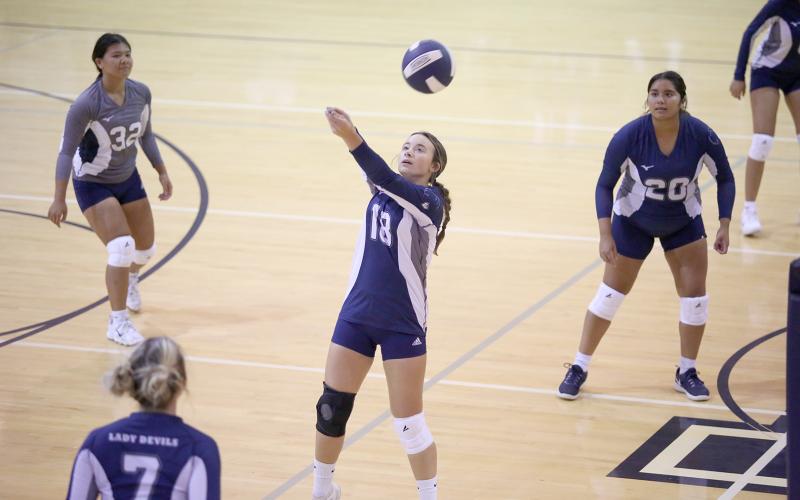 Katie Nguyen (No. 31), Lizzy Landaverde (No. 20) and Georgia Phillips watch as Ryleigh Rosenburg (No. 18) bumps the ball during the Volley Devils’ win over Commerce High School Aug. 30 at Elbert County Comprehensive High School. The Volley Devils went on to defeat area foe and top state-ranked team Athens Christian Sept. 1. (Photo by Wells)