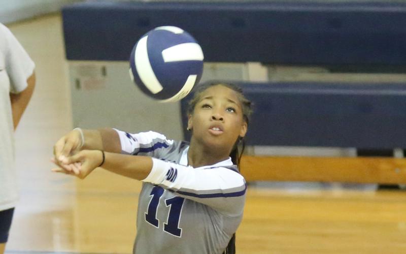 Ja’Nydra Watts bumps the ball during one of the Lady Rams’ sets against the Lady Indians. (Photo by Wells)