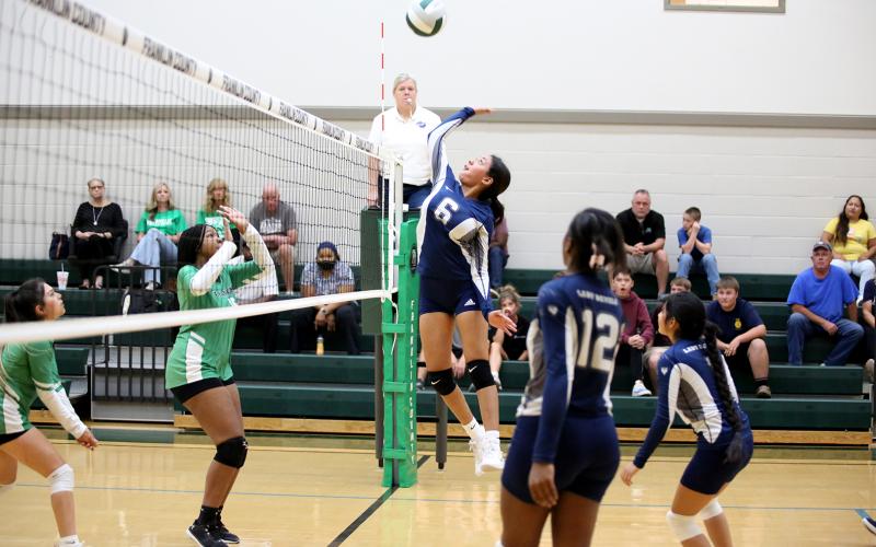 Lizett Nava jumps to spike the ball over the net during the Lady Devils’ win over Franklin County Thursday, Sept. 22 in Carnesville. (Photo by Scoggins)