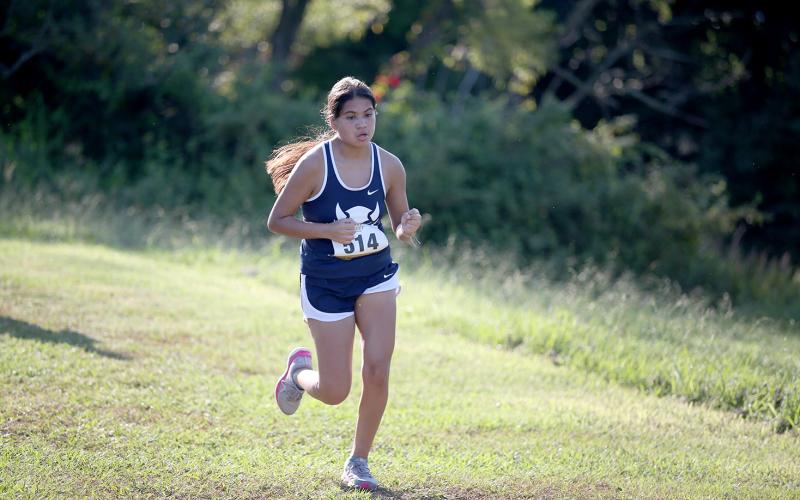 Lady Devil runner Linda Garcia (right) is No. 5 in the region for female runners. (Photo by Scoggins)