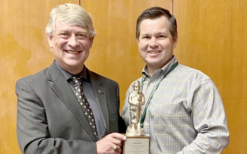 Elbert County’s Mark Wiles (left) received a Silver Smokey Award, the top honor for those working in wildfire prevention, in September.