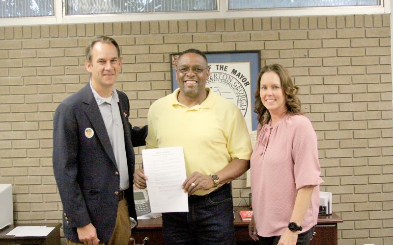 The City of Elberton and the Elbert County Board of Commissioners recently signed proclamations for the Elbert County Chamber of Commerce’s celebration of “National Support your Local Chamber of Commerce” day. Pictured with the proclamations are (L-R) Mayor Daniel Graves, Chamber Chairman Kam McClary and Executive Director/President Rebecca Holliday (Photo by Wells)