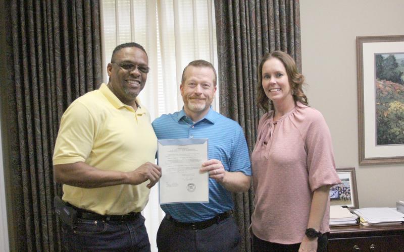 The City of Elberton and the Elbert County Board of Commissioners recently signed proclamations for the Elbert County Chamber of Commerce’s celebration of “National Support your Local Chamber of Commerce” day. Pictured with the proclamations are (L-R) Chamber Chairman Kam McClary, Chairman Lee Vaughn and Executive Director/President Rebecca Holliday. (Photo by Wells)