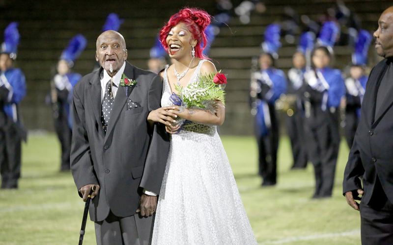 Elbert County Comprehensive High School senior Jamia Allen (right) was named the 2022 Homecoming Queen during Thursday’s homecoming game. Allen, a member of the 2021-2022 AA State Champion basketball team, was escorted by her grandfather James Zanders. See more photos from the homecoming football game and parade on pages 8, 9 and 11. (Photo by Scoggins)