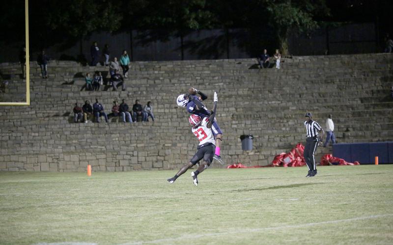 Senior Trustin Allen is rammed by a Rabun County Wildcat as he attempts to catch a pass during the Devils’ first loss of the season in the Granite Bowl Friday, Oct. 14. (Photo by Wells)