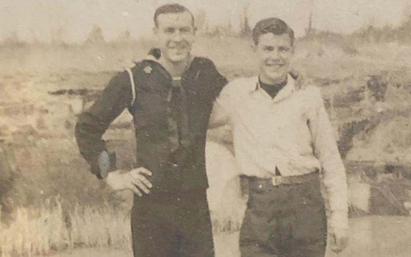 Eugene “Gene” Wallace (left) visits his brother, Ezra Wallace (right) on a short trip home during his time as a Navy Seabee in 1945.