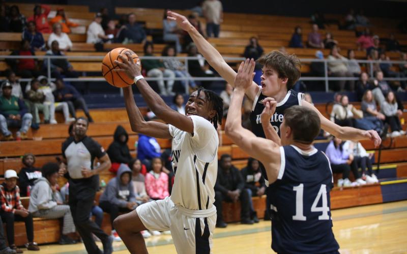 Junior Kamaurion “Tank” Givens goes for the basket during the Devils’ loss to White County during a scrimmage in the Inferno Thursday, Nov. 10. The Devils are looking to bring the mantra of “HEAT” to the Inferno this season under new Head Coach Ed Geth. (Photo by Wells)