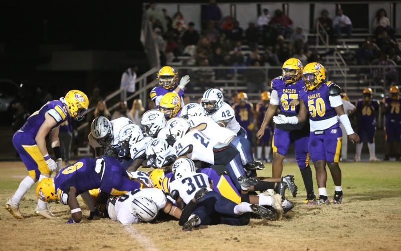 A Devil dogpile attempts to recover a fumbled ball during the last regular season game vs. Athens Christian Oct. 28. The Devils are looking to make it past the first round of the GHSA state playoffs Friday, Nov. 11. (Photo by Scoggins)