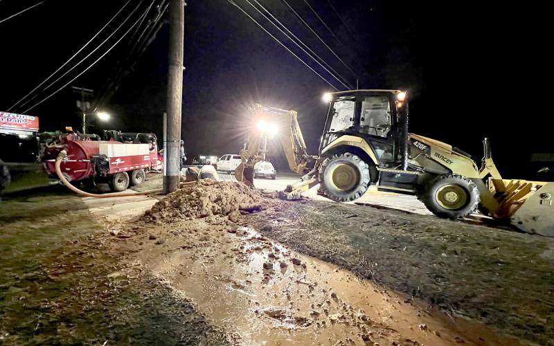 Crews from the City of Elberton worked to fix a water main break on Elbert Street on Christmas Eve. (Right photo courtesy of Devan Boswell)